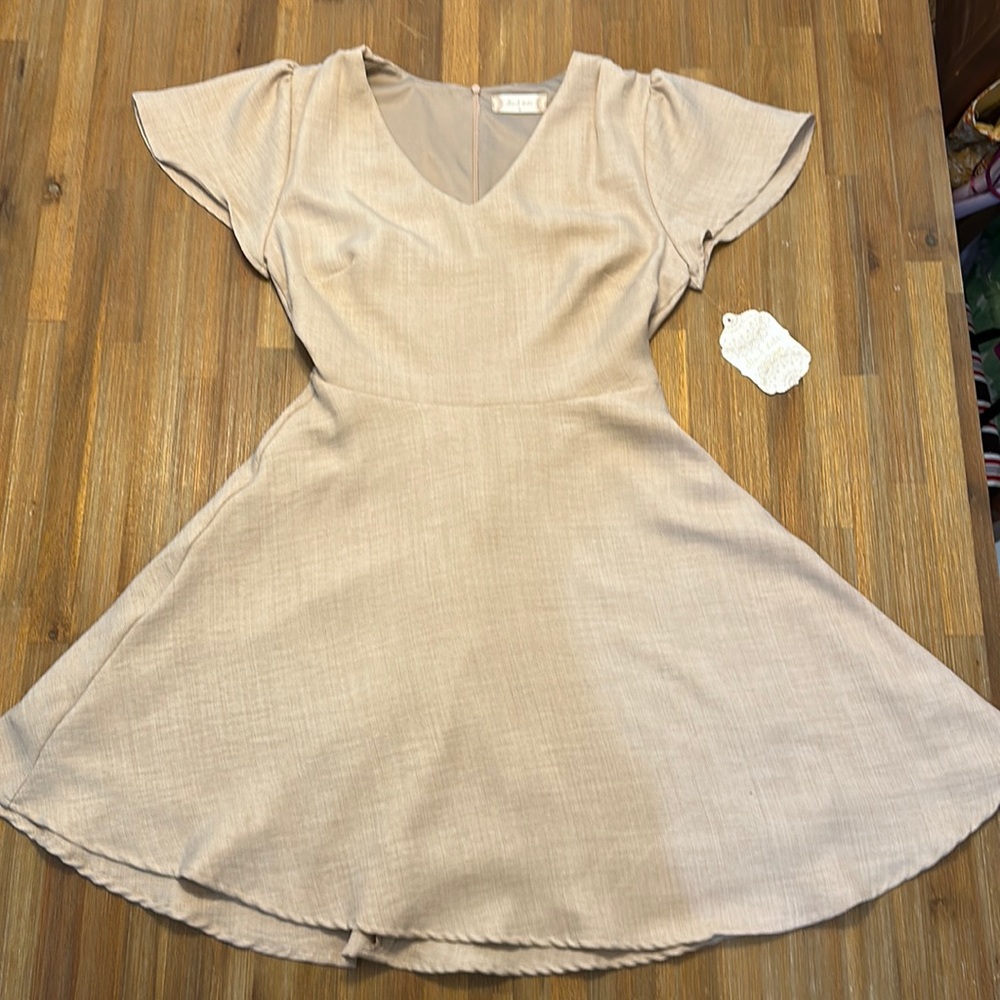 Feminine alter’d state dress size 4.  Tags on never worn.